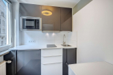 Einbauküche - SITULI: Schmuckstück im Herzogpark – 1-Zimmer-Apartment mit Balkon